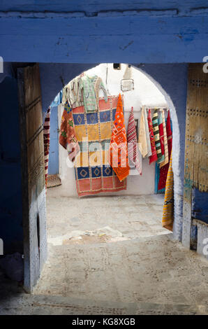 Hanging carpets in Chefchaouen's medina, North Morocco Stock Photo