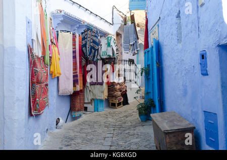 Displayed carpets and rugs in Chefchaouen's medina, Morocco Stock Photo