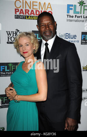 FORT LAUDERDALE, FL - OCTOBER 21 : Actor Penelope Ann Miller Dennis Haysbert arrives at The 26TH Annual Fort Lauderdale International Film Festival kick off at Bailey Hall Broward College Campus.  on October 21, 2011 in Fort Lauderdale, Florida.      People:   Penelope Ann Miller and Dennis Haysbert  Credit: Hoo-Me.com/MediaPunch Stock Photo