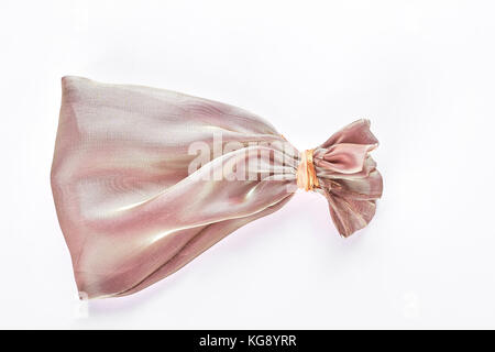 Silk pouch for jewelry, white background. Stock Photo
