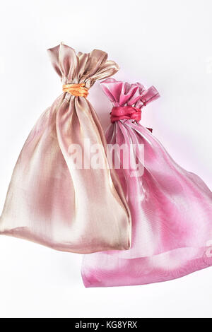 Beige and pink jewelry bags. Stock Photo