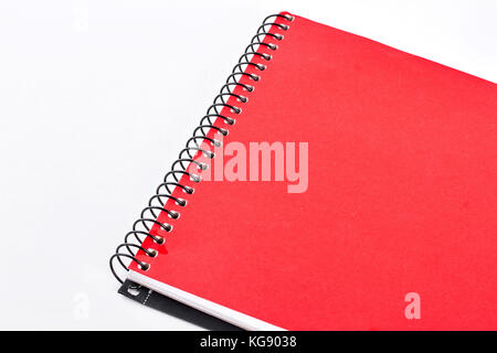 Red notepad on white background. Stock Photo
