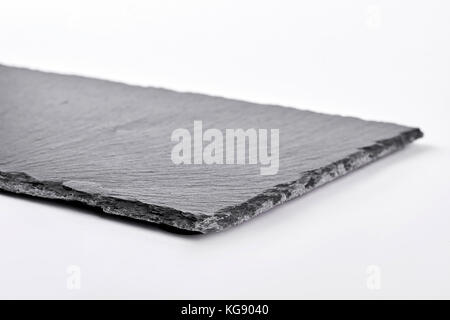 Square slate tray, white background. Stock Photo