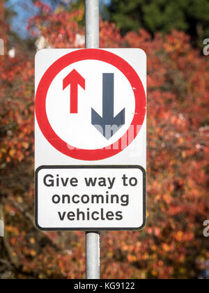 Give Way to Oncoming Vehicles - UK Road Sign Stock Photo