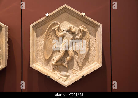 Carved stone panel  maths in the Interior of Museum of the works from the Cathedral del Duomo Stock Photo
