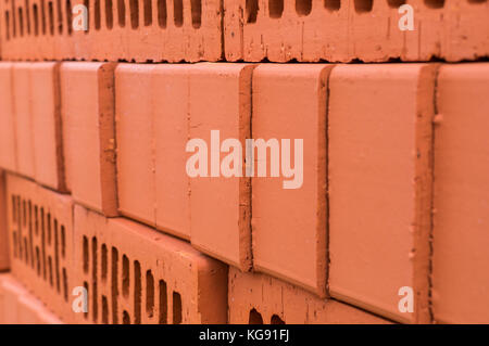 orange clay brick stack, pile. texture, background. Stock Photo