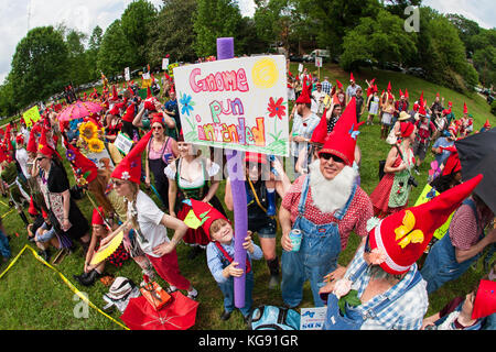 Atlanta, GA, USA - April 29, 2017:  Dozens of people dressed like gnomes gather at Inman Park to attempt a world record for most gnomes gathered. Stock Photo