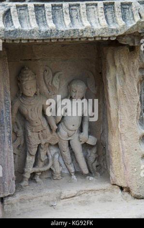 Carved idol of gods on the inner wall of a small shrine. Built in 1026 - 27 AD during the reign of Bhima I of the Chaulukya dynasty, Modhera village o Stock Photo