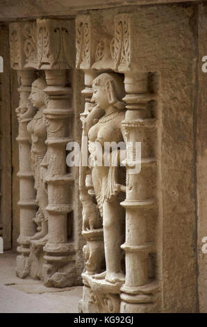 Carving details of an idol of apsara, located on the inner wall of Rani ki vav, an intricately constructed stepwell. Patan, Gujarat, India. Stock Photo