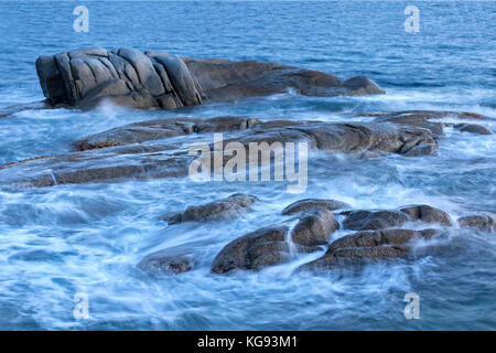 Beautiful sunrise in a bay with rocks in Costa Brava (Catalonia), Spain, long exposure Stock Photo