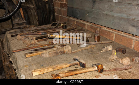 In the rural forge on the table is a different forging tool Stock Photo