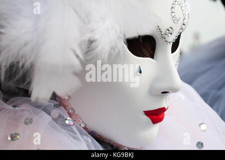 close up white Venice  carnevale mask with red lips and tear gem Stock Photo
