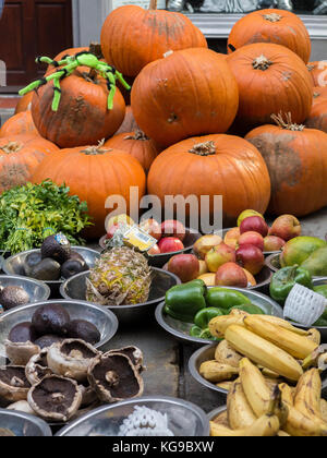 A pile of pumpkins for sale in a market stall at Halloween time Stock Photo