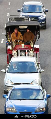 Competitors in the vintage automobiles negotiate the busy A23 into Brighton during the London to Brighton Veteran Car Run. 05 Nov 2017 Stock Photo