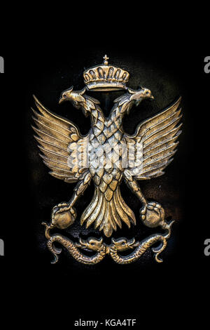 Golden Double Headed Eagle on Black Metal Background, Roman and Byzantine Empire Symbol Stock Photo