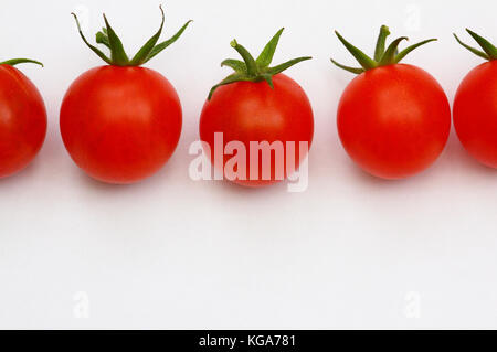 fresh ripe red cherry tomatoes on a white background Stock Photo