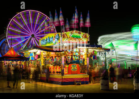 Light trails from an amusement ride on the midway at the Minnesota State Fair. Stock Photo