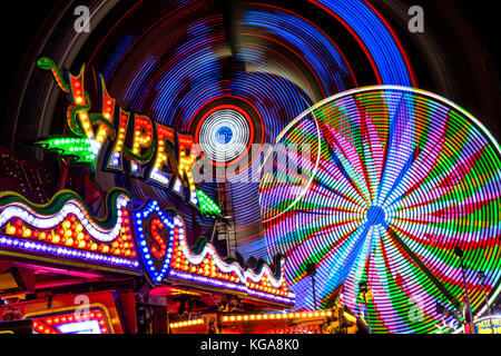 Light trails from an amusement ride on the midway at the Minnesota State Fair. Stock Photo