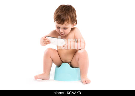 child sitting on the potty Stock Photo