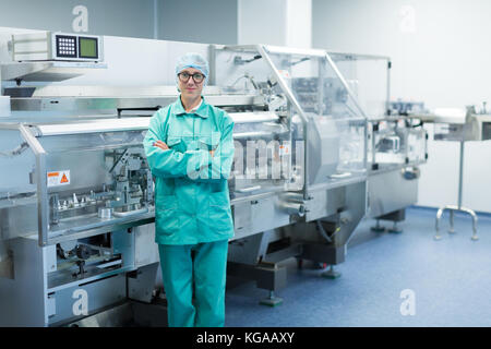 operator in the pharmaceutical factory near the equipment Stock Photo