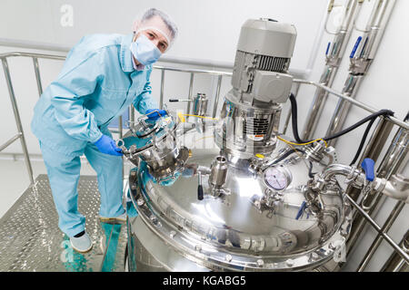 scientist is working with steel tanks Stock Photo