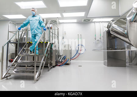 plant picture, scientist is standing on ladder in laboratory Stock Photo