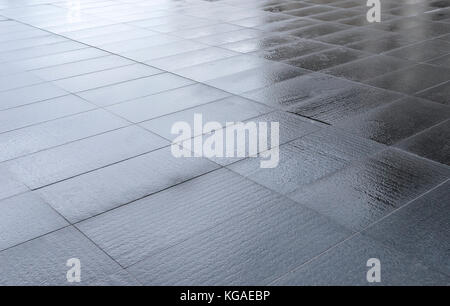 Wet street tiles. Stock Photo