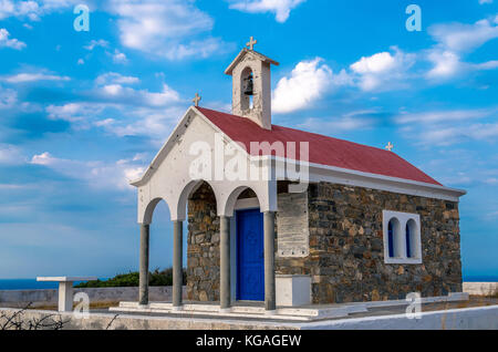 picturesque orthodox chapel on the top of the hill with stunning view the aegean sea  in north crete. Stock Photo