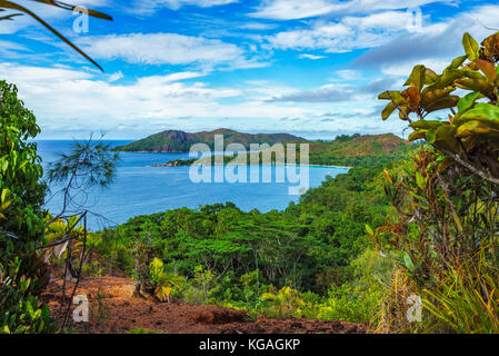 Hiking throug the jungle between the paradise beaches anse lazio and anse georgette, praslin, seychelles. Overview from the top of a mountain... Stock Photo