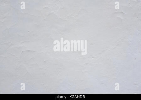 Clay wall is whitewashed by lime, textured background Stock Photo