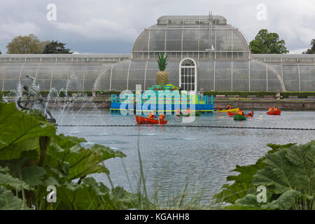 Kew Gardens launches summer festival 'IncrEdibles' with a 'Tutti Frutti Boating Experience' on Palm House Pond designed by Bompas & Parr, a 'Bouncy Carrot Patch' and an 'Alice in Wonderland'-inspired Tea Party in the Rose Garden. The Festival runs from 25 May to 3 November 2013, boating finishes 1 September. Stock Photo