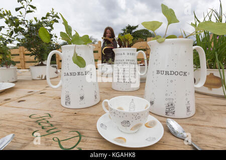 Pictured: Tea Party in the Rose Garden by designer Kirsti Davies. Kew Gardens launches summer festival 'IncrEdibles' with a 'Tutti Frutti Boating Experience' on Palm House Pond designed by Bompas & Parr, a 'Bouncy Carrot Patch' and an 'Alice in Wonderland'-inspired Tea Party in the Rose Garden. The Festival runs from 25 May to 3 November 2013, boating finishes 1 September. Stock Photo