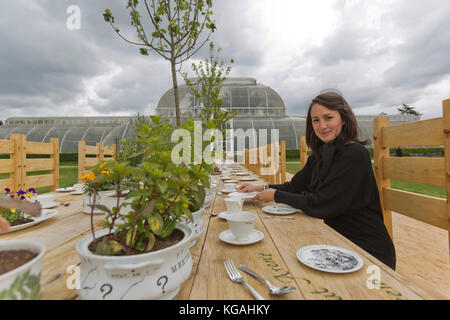 Pictured: Tea Party in the Rose Garden with designer Kirsti Davies. Kew Gardens launches summer festival 'IncrEdibles' with a 'Tutti Frutti Boating Experience' on Palm House Pond designed by Bompas & Parr, a 'Bouncy Carrot Patch' and an 'Alice in Wonderland'-inspired Tea Party in the Rose Garden. The Festival runs from 25 May to 3 November 2013, boating finishes 1 September. Stock Photo