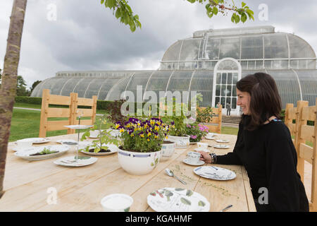 Pictured: Tea Party in the Rose Garden with designer Kirsti Davies. Kew Gardens launches summer festival 'IncrEdibles' with a 'Tutti Frutti Boating Experience' on Palm House Pond designed by Bompas & Parr, a 'Bouncy Carrot Patch' and an 'Alice in Wonderland'-inspired Tea Party in the Rose Garden. The Festival runs from 25 May to 3 November 2013, boating finishes 1 September. Stock Photo