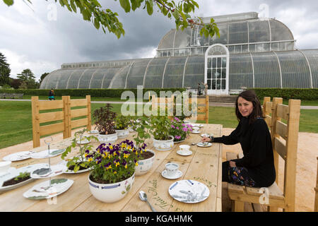 Pictured: Tea Party in the Rose Garden with designer Kirsti Davies. Kew Gardens launches summer festival 'IncrEdibles' with a 'Tutti Frutti Boating Experience' on Palm House Pond designed by Bompas & Parr, a 'Bouncy Carrot Patch' and an 'Alice in Wonderland'-inspired Tea Party in the Rose Garden. The Festival runs from 25 May to 3 November 2013, boating finishes 1 September. Stock Photo