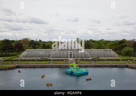 Pictured: High-angle view of the Palm House Pond with the 'Floating Pineapple Island'. Kew Gardens launches summer festival 'IncrEdibles' with a 'Tutti Frutti Boating Experience' on Palm House Pond designed by Bompas & Parr, a 'Bouncy Carrot Patch' and an 'Alice in Wonderland'-inspired Tea Party in the Rose Garden. The Festival runs from 25 May to 3 November 2013, boating finishes 1 September. Stock Photo