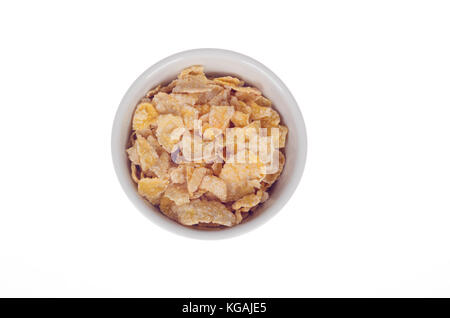Bowl of Kellogg's Frosted Flakes or Frosties sugar coated corn flakes cereal in bowl isolated from above on white background Stock Photo