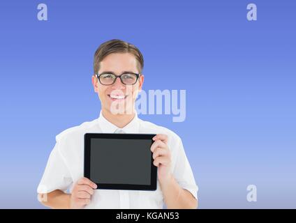 Digital composite of Man holding tablet with blue background Stock Photo