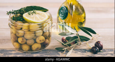 Green olives preserved in jar, preserve Stock Photo