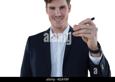 Portrait of businessman writing on an invisible screen Stock Photo