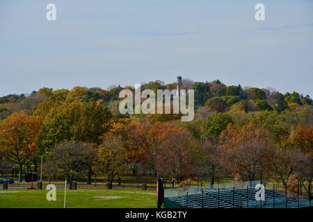 A view of the iconic and historic Mount Auburn Cemetery atop Mount Auburn in Watertown, Massachusetts as seen from Boston in the fall Stock Photo