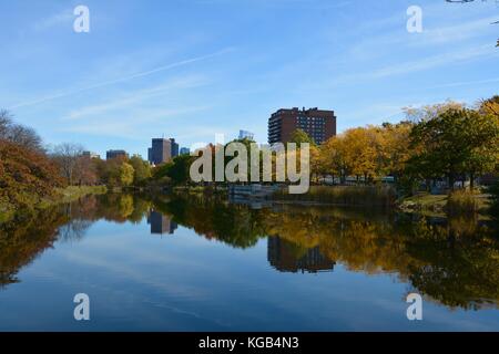 Reflection of the Boston Back Bay skyline in Autumn seen from the Charles River Esplanade Stock Photo