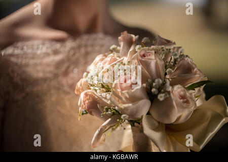 Big nice wedding bouquet in woman's hands. Bride on her wedding ceremony. Stock Photo