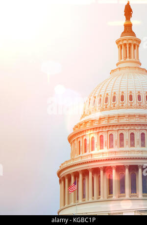 Washington DC Capitol dome detail with waving american flag Stock Photo ...