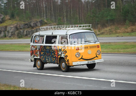 PAIMIO, FINLAND – NOVEMBER 1, 2015: Painted Volkswagen Type 2 Camper Van on motorway in South of Finland. The Type 2 was first introduced in 1950 by t Stock Photo
