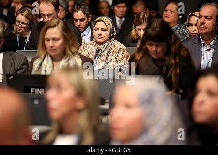 Bonn, Germany. 6th Nov, 2017. The delegates follow the opening of the conference in Bonn, Germany, 6 November 2017. The World Climate Conference is taking place from the 6 to the 17 of November in Bonn, Germany Credit: Oliver Berg/dpa/Alamy Live News Stock Photo