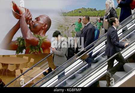 Bonn, Germany. 6th Nov, 2017. The delegates pass by a poster of the Fiji Islands in Bonn, Germany, 6 November 2017. The World Climate Conference is taking place from the 6 to the 17 of November in Bonn, Germany. Credit: Oliver Berg/dpa/Alamy Live News Stock Photo