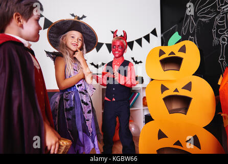 Children in halloween costumes at traditional festival Stock Photo