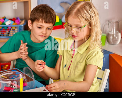 Plasticine modeling clay in children class. kids together play dough and  mold from plasticine in kindergarten or preschool. Teaching modeling.  Develop Stock Photo - Alamy