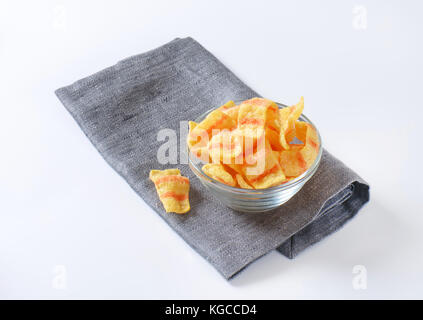 Bowl of bacon-flavored puffed wheat chips Stock Photo